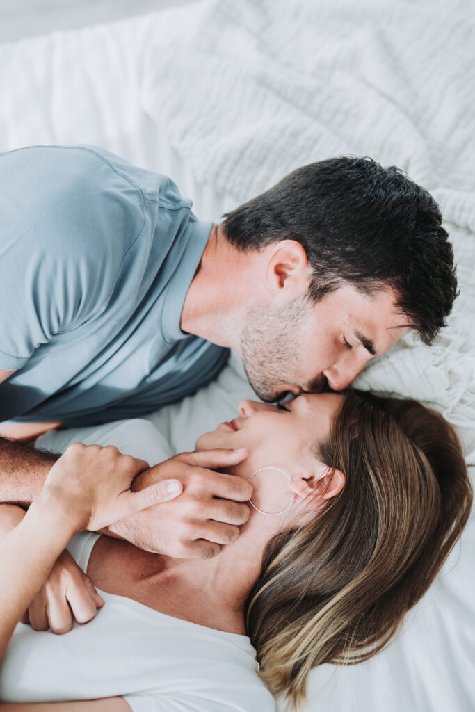 couple laying on bed 