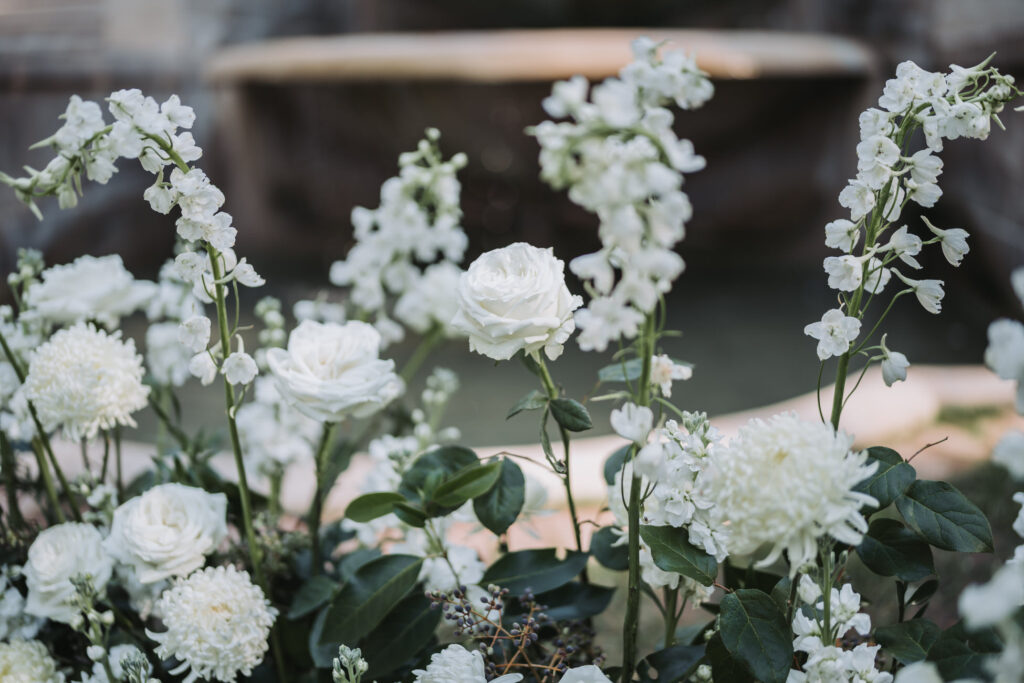 Flowers at the wedding ceremony site at the swan house.