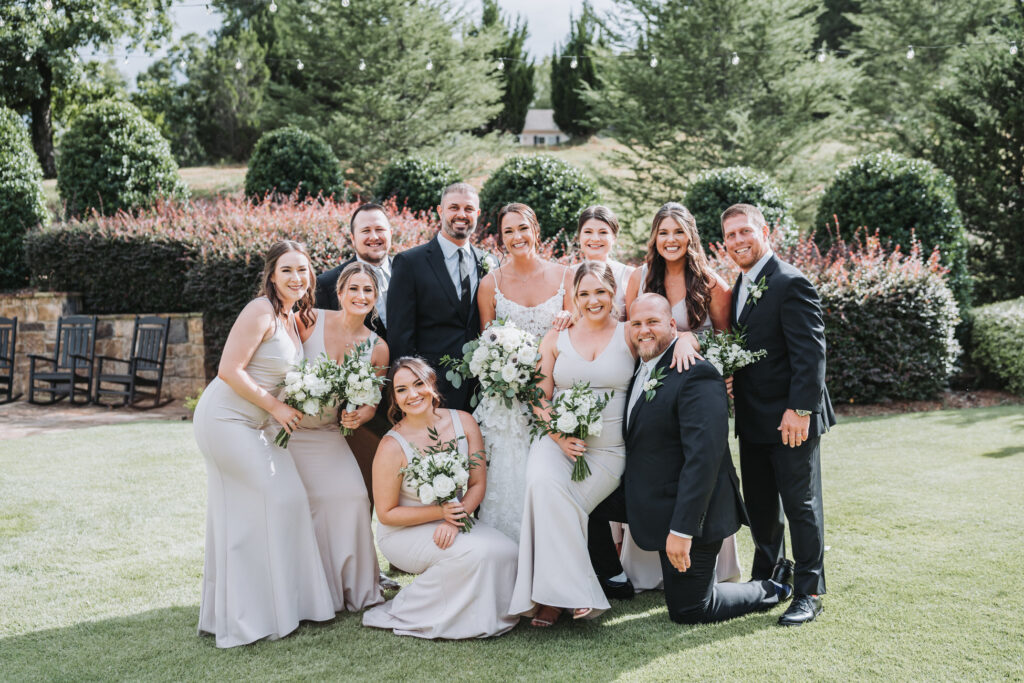 Full wedding party photo in the garden at Yonah mountain vineyards.