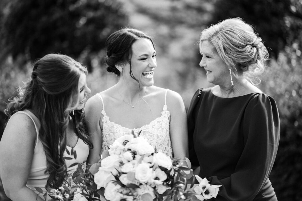 Bride smiles at mother in law.