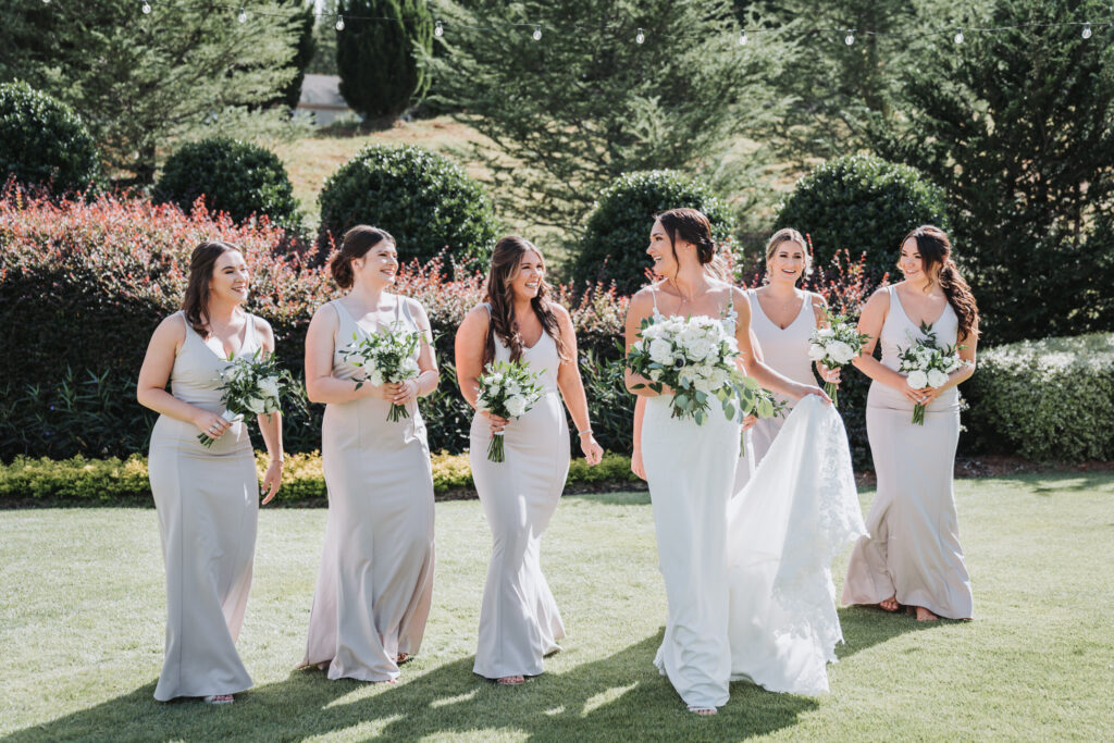Bride and Bridesmaids walk towards the wedding venue.