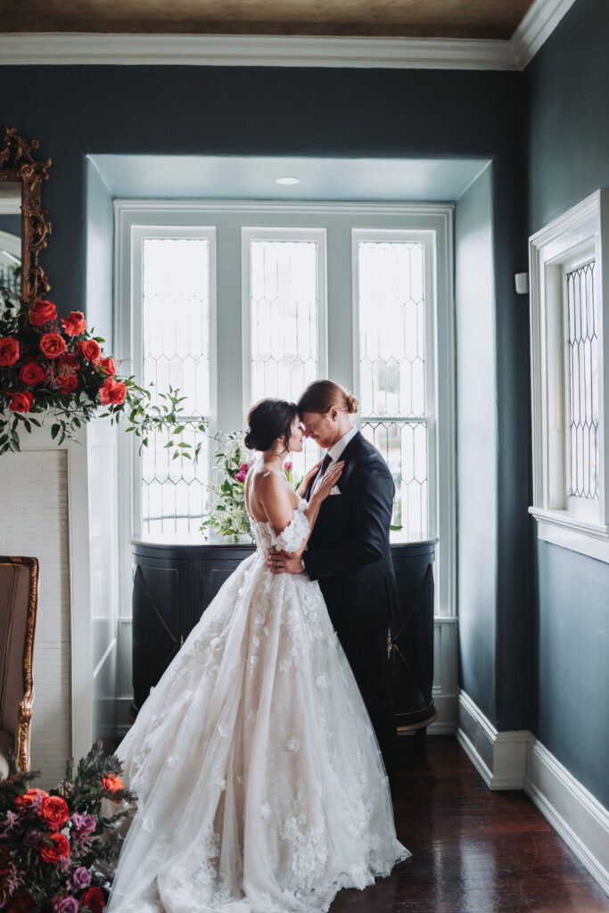 Bride and groom hold each other.