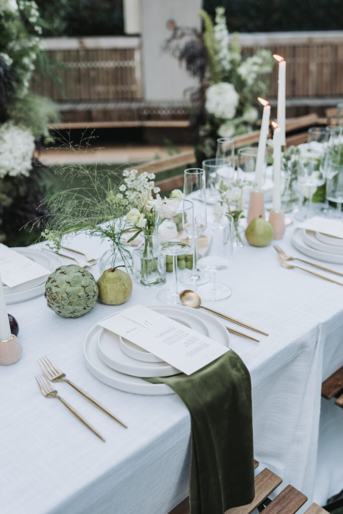 reception table details with pears and greenery