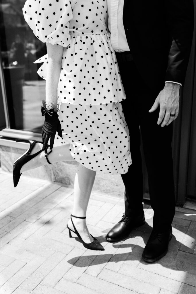 Bride adjusts her shoes.
