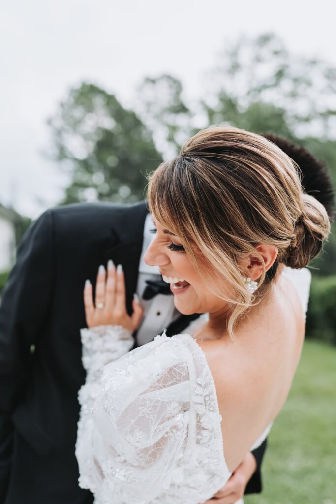 Bride laughing at wedding