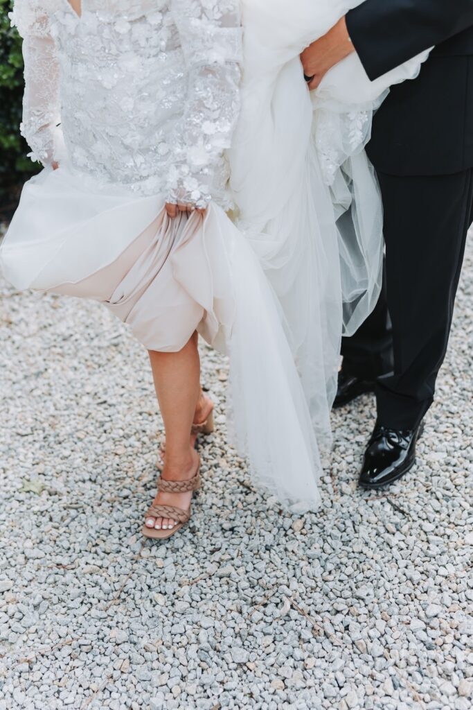 bride showing off her wedding shoes