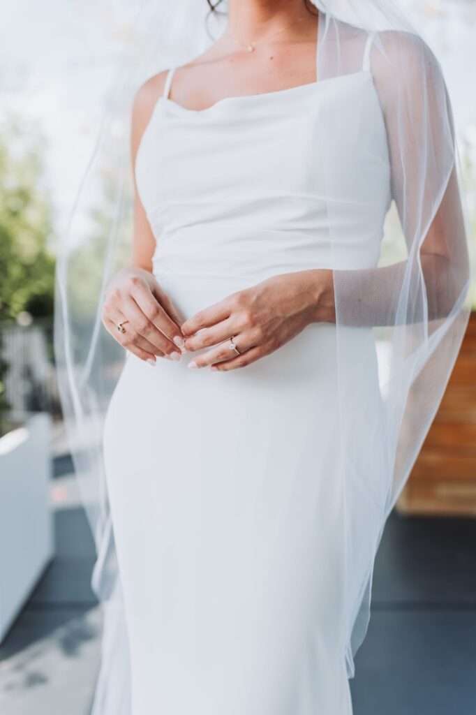 bride with engagement ring showing
