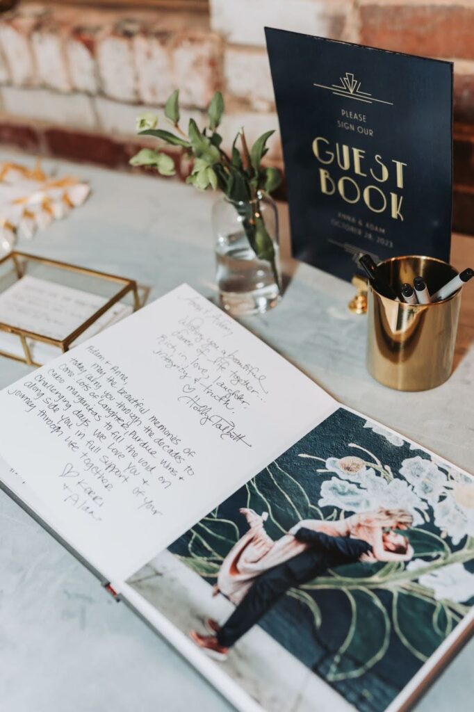 Engagement photos displayed at a wedding table