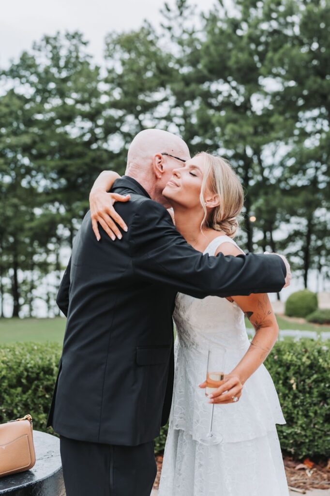 Bride hugs father