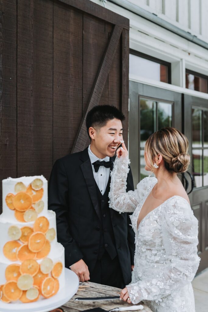 bride and groom sharing wedding cake
