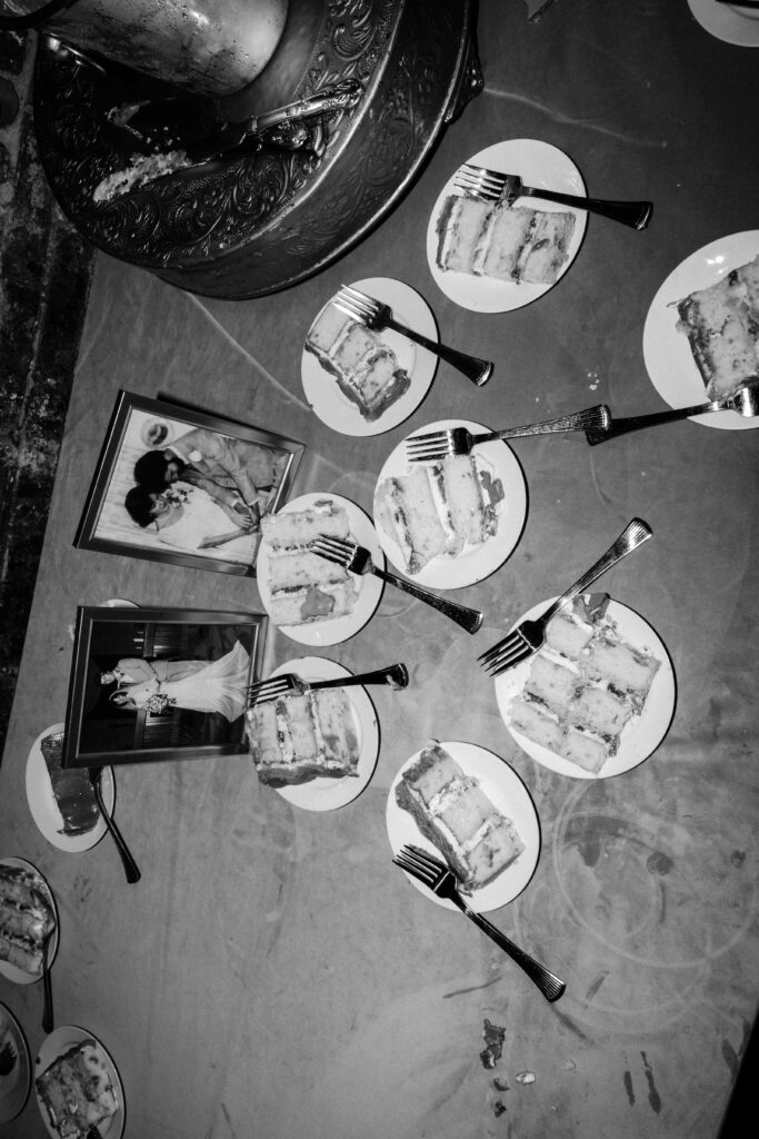 Black and white photo of wedding cake slices.