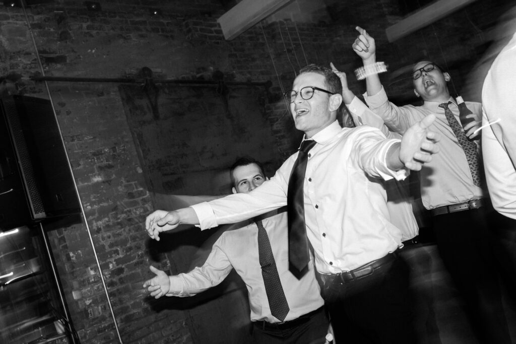 People dancing with open arms
