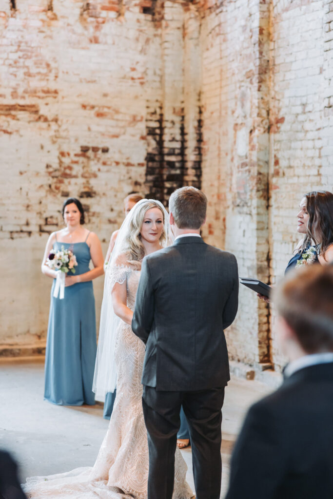 bride holds grooms hand