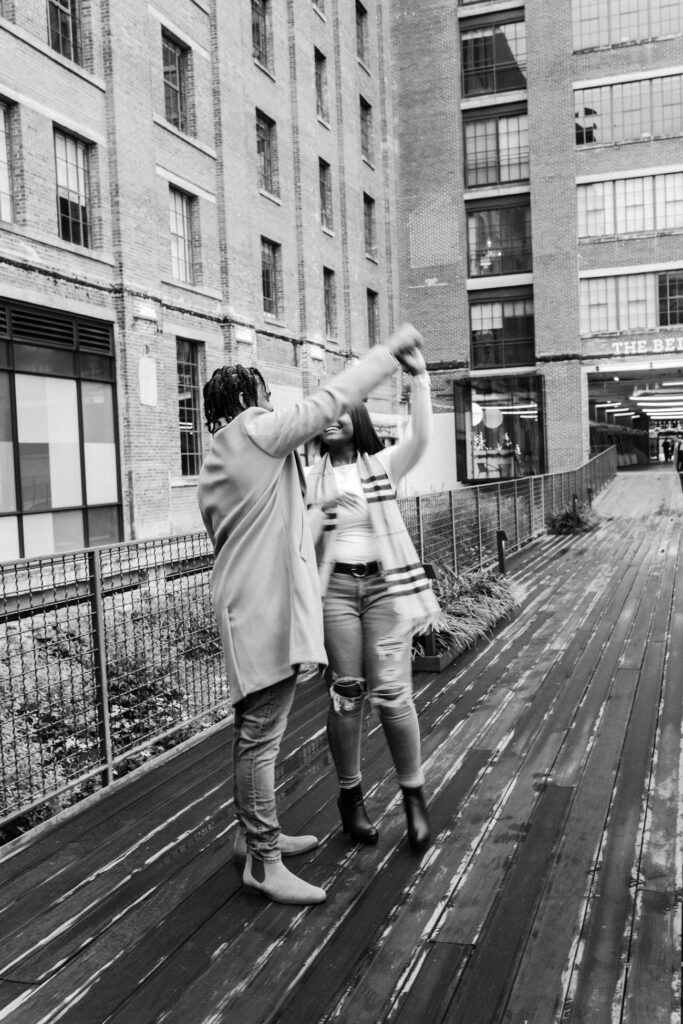 guy spins girl while at Ponce City market