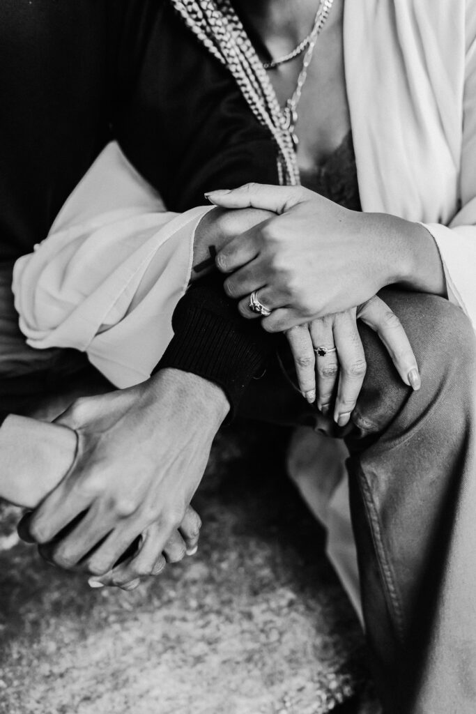 closeup on girl and guy holding hands