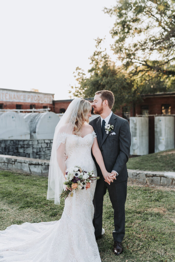 groom kisses bride's forehead