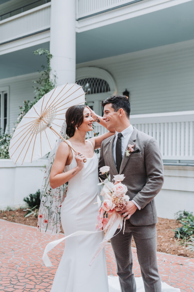 Bride and groom look at each other as they laugh